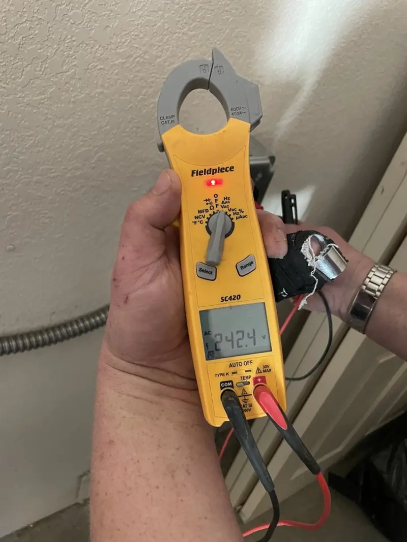 Voltage testing with clamp meter during Recessed Lighting Installation in Chincoteague
